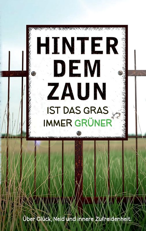 Hinter dem Zaun ist das Gras immer grüner