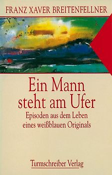 Ein Mann steht am Ufer